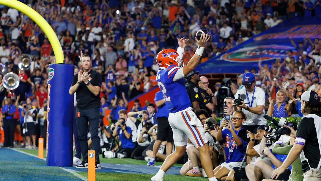Sep 5, 2026; Gainesville, Florida, USA;  Florida Gators quarterback Aaron Philo (12) celebrates after scoring a touchdown against the Florida Atlantic Owls during the first half at Ben Hill Griffin Stadium.  Mandatory Credit: Matt Pendleton-Imagn Images