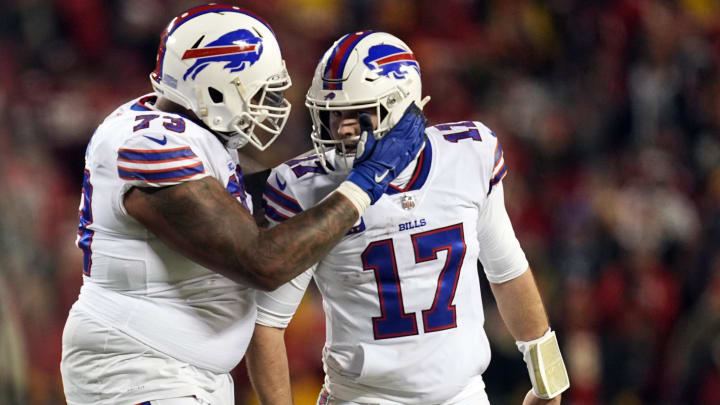 Jan 23, 2022; Kansas City, MO; Buffalo Bills quarterback Josh Allen (17) celebrates offensive tackle Dion Dawkins (73) following a touchdown during the fourth quarter of the AFC Divisional playoff football game against the Kansas City Chiefs at GEHA Field at Arrowhead Stadium. 