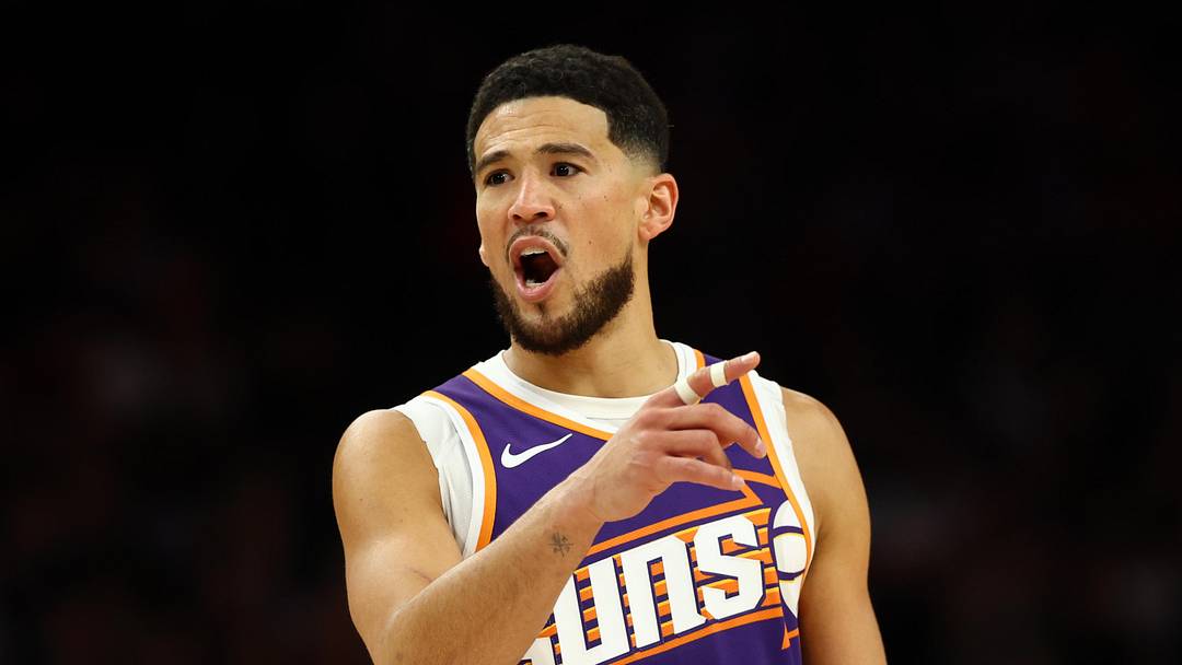 Mar 24, 2026; Phoenix, Arizona, USA; Phoenix Suns guard Devin Booker (1) reacts against the Denver Nuggets in the first half at Mortgage Matchup Center. Mandatory Credit: Mark J. Rebilas-Imagn Images