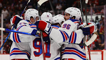 May 26, 2024; Sunrise, Florida, USA; New York Rangers center Alex Wennberg (91) celebrates with center Jack Roslovic (96) and right wing Kaapo Kakko (24) after scoring the game-winning goal in overtime against the Florida Panthers in game three of the Eastern Conference Final of the 2024 Stanley Cup Playoffs at Amerant Bank Arena. Mandatory Credit: Sam Navarro-Imagn Images