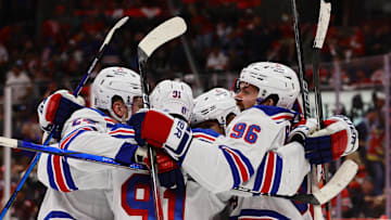 May 26, 2024; Sunrise, Florida, USA; New York Rangers center Alex Wennberg (91) celebrates with center Jack Roslovic (96) and right wing Kaapo Kakko (24) after scoring the game-winning goal in overtime against the Florida Panthers in game three of the Eastern Conference Final of the 2024 Stanley Cup Playoffs at Amerant Bank Arena. Mandatory Credit: Sam Navarro-Imagn Images