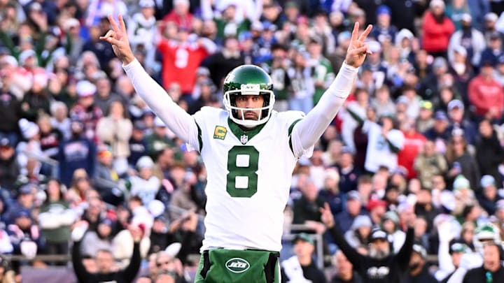 New York Jets quarterback Aaron Rodgers (8) reacts after throwing for a touchdown against the New England Patriots during the second half at Gillette Stadium. New York Jets quarterback Aaron Rodgers (8) reacts after throwing for a touchdown against the New England Patriots during the second half at Gillette Stadium.