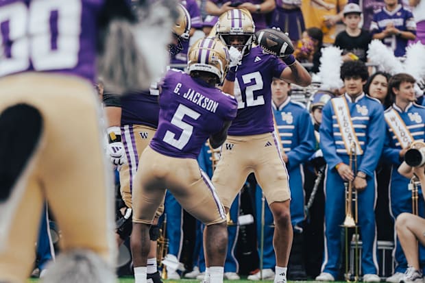 Giles Jackson (5) and Denzel Boston (12) celebrate a Boston touchdown against Eastern Michigan.