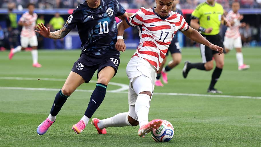Malik Tillman dribbling.