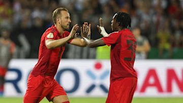 Mathys Tel and Harry Kane 