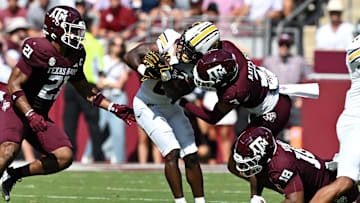 Texas A&M Aggies defensive back Marcus Ratcliffe (3) tackles Missouri Tigers running back Nate Noel (8) in the first quarter at Kyle Field. 