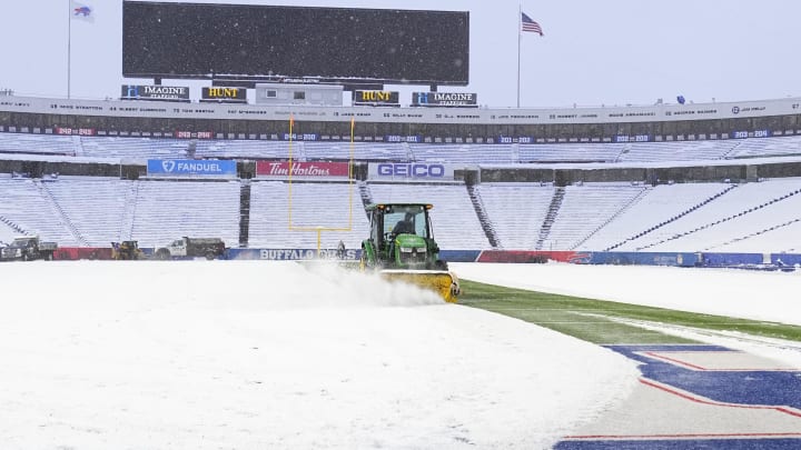 Dec 17, 2022; Orchard Park, New York, USA; A general view of the grounds crew removing snow from the