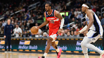 Mar 21, 2025; Washington, District of Columbia, USA; Washington Wizards forward Alex Sarr (20) handles the ball against Orlando Magic center Wendell Carter Jr. (34) during the third quarter at Capital One Arena. Mandatory Credit: Reggie Hildred-Imagn Images