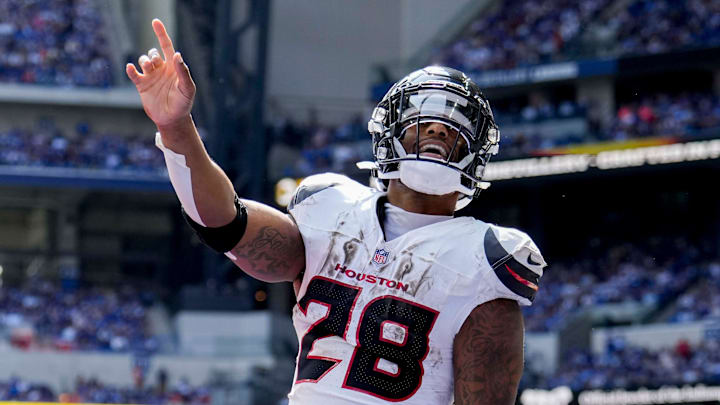 Houston Texans running back Joe Mixon (28) celebrates after scoring a touchdown Sunday, Sept. 8, 2024, during a game against the Indianapolis Colts at Lucas Oil Stadium in Indianapolis.