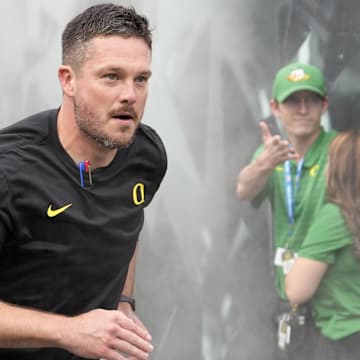 Sep 23, 2023; Eugene, Oregon, USA; Oregon Ducks head coach Dan Lanning leads his team on the field prior to the game against the Colorado Buffaloes at Autzen Stadium. Mandatory Credit: Soobum Im-Imagn Images