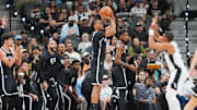 Oct 26, 2025; San Antonio, Texas, USA; Brooklyn Nets forward Ziaire Williams (1) shoots over San Antonio Spurs forward Keldon Johnson (3) in the first half at Frost Bank Center. Mandatory Credit: Daniel Dunn-Imagn Images