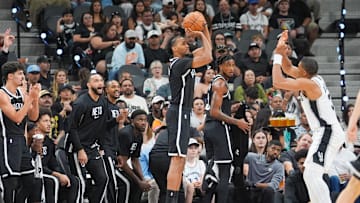 Oct 26, 2025; San Antonio, Texas, USA; Brooklyn Nets forward Ziaire Williams (1) shoots over San Antonio Spurs forward Keldon Johnson (3) in the first half at Frost Bank Center. Mandatory Credit: Daniel Dunn-Imagn Images