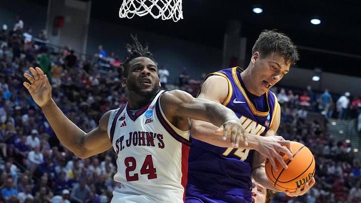 Mar 20, 2026; San Diego, CA, USA; St. John's basketball forward Zuby Ejiofor (24) and Northern Iowa Panthers forward Tristan Smith (14) grab a rebound in the second half during a first round game of the men's 2026 NCAA Tournament at Viejas Arena.