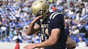 Sep 21, 2024; Annapolis, Maryland, USA;  Navy Midshipmen quarterback Blake Horvath (11) celebrates after scoring a first half touchdown against the Memphis Tigers at Navy-Marine Corps Memorial Stadium. Mandatory Credit: Tommy Gilligan-Imagn Images