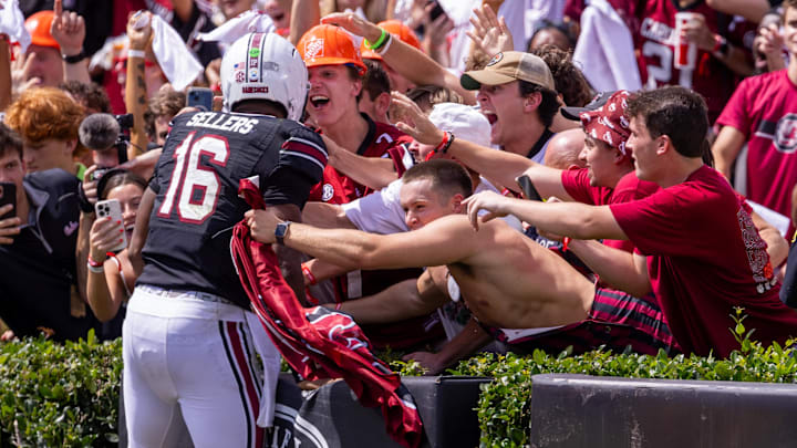 South Carolina football quarterback LaNorris Sellers celebrating with Gamecock students after a touchdown against LSU