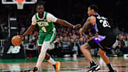 Mar 10, 2025; Boston, Massachusetts, USA; Boston Celtics guard Jrue Holiday (4) controls the ball while Utah Jazz forward John Collins (20) defends during the first half at TD Garden. Mandatory Credit: Bob DeChiara-Imagn Images
