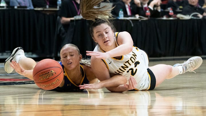 Hinton's Sydney Doeschot and Central Lyon's Georgie Oedekoven collide while going for a loose ball during the 2A IGHSAU state basketball championship at Wells Fargo Arena on Saturday, March 8, 2025, in Des Moines. Hinton's Sydney Doeschot and Central Lyon's Georgie Oedekoven collide while going for a loose ball during the 2A IGHSAU state basketball championship at Wells Fargo Arena on Saturday, March 8, 2025, in Des Moines.
