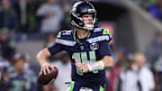 Oct 20, 2025; Seattle, Washington, USA; Seattle Seahawks quarterback Sam Darnold (14) looks to throw a pass during the second quarter against the Houston Texans at Lumen Field. Mandatory Credit: Kevin Ng-Imagn Images