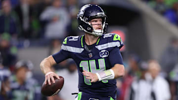 Oct 20, 2025; Seattle, Washington, USA; Seattle Seahawks quarterback Sam Darnold (14) looks to throw a pass during the second quarter against the Houston Texans at Lumen Field. Mandatory Credit: Kevin Ng-Imagn Images