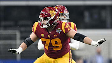 Jan 2, 2023; Arlington, Texas, USA; USC Trojans offensive lineman Jonah Monheim (79) in action during the game between the USC Trojans and the Tulane Green Wave in the 2023 Cotton Bowl at AT&T Stadium. Mandatory Credit: Jerome Miron-Imagn Images