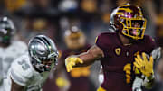 Arizona State Sun Devils running back Xazavian Valladay (1) runs the ball against Eastern Michigan Eagles defensive back Quentavius Scandrett (35) at Sun Devil Stadium in Tem
