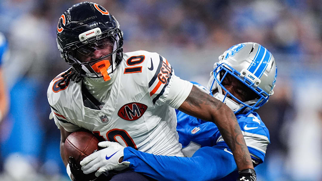 Detroit Lions cornerback D.J. Reed (4) tackles Chicago Bears wide receiver Luther Burden III (10) during the second half at Ford Field in Detroit on Sunday, Sept. 14, 2025.