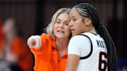 Oklahoma State coach Jacie Hoyt talks with guard Jadyn Wooten (6) during a women's college basketball game between the Oklahoma State Cowgirls (OSU) and the Arizona State Sun Devils at Gallagher-Iba Arena in Stillwater, Okla., Wednesday, Jan. 29, 2025.