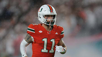 Sep 20, 2025; Miami Gardens, Florida, USA; Miami Hurricanes quarterback Carson Beck (11) runs on the field before the game against the Florida Gators at Hard Rock Stadium. Mandatory Credit: Sam Navarro-Imagn Images