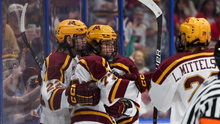 Apr 6, 2023; Tampa, Florida, USA; Minnesota forward Rhett Pitlick (77) celebrates after scoring a goal against Boston University in the first period in the semifinals of the 2023 Frozen Four college ice hockey tournament at Amalie Arena. Mandatory Credit: Nathan Ray Seebeck-USA TODAY Sports