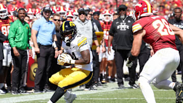 Sep 6, 2025; Ames, Iowa, USA; Iowa Hawkeyes running back Jaziun Patterson (4) runs with the ball against the Iowa State Cyclones during the second quarter at Jack Trice Stadium. Mandatory Credit: Reese Strickland-Imagn Images