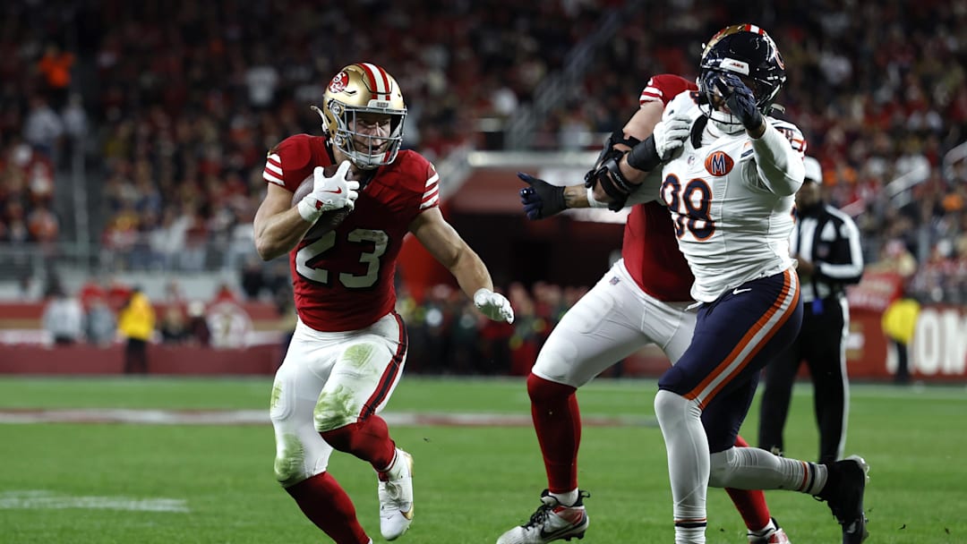 Dec 28, 2025; Santa Clara, California, USA; San Francisco 49ers running back Christian McCaffrey (23) runs for a touchdown against the Chicago Bears in the first half at Levi's Stadium. Mandatory Credit: Sergio Estrada-Imagn Images