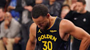 Nov 26, 2025; San Francisco, California, USA;  Golden State Warriors guard Stephen Curry (30) gets up injured after a play against the Houston Rockets in the fourth quarter at Chase Center. Mandatory Credit: David Gonzales-Imagn Images