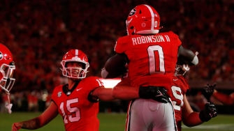 Georgia running back Roderick Robinson II (0) celebrates with his teammates after scoring a touchdown during the second half of a NCAA college football game against Tennessee Martin in Athens, Ga., on Saturday, Sept. 2, 2023. Georgia won 48-7.