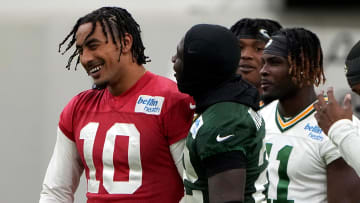 Jun 11, 2024; Green Bay, WI, USA; Green Bay Packers quarterback Jordan Love (10) laughs with teammates at minicamp. Mandatory Credit: Mark Hoffman-USA TODAY Sports