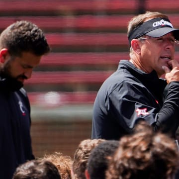 Cincinnati Bearcats head coach Scott Satterfield speaks with players after a scrimmage, Saturday, Aug. 10, 2024, at Nippert Stadium in Cincinnati.