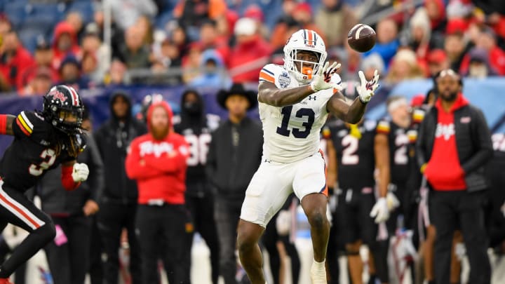 Dec 30, 2023; Nashville, TN, USA;  Auburn Tigers tight end Rivaldo Fairweather (13) makes a catch against the Maryland Terrapins during the second half at Nissan Stadium. Mandatory Credit: Steve Roberts-USA TODAY Sports