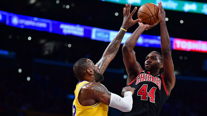 Jan 25, 2024; Los Angeles, California, USA; Chicago Bulls forward Patrick Williams (44) shoots against Los Angeles Lakers forward LeBron James (23) during the second half at Crypto.com Arena. Mandatory Credit: Gary A. Vasquez-Imagn Images