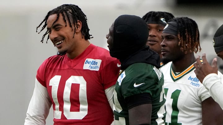 Jun 11, 2024; Green Bay, WI, USA; Green Bay Packers quarterback Jordan Love (10) laughs with teammates at minicamp. Mandatory Credit: Mark Hoffman-USA TODAY Sports