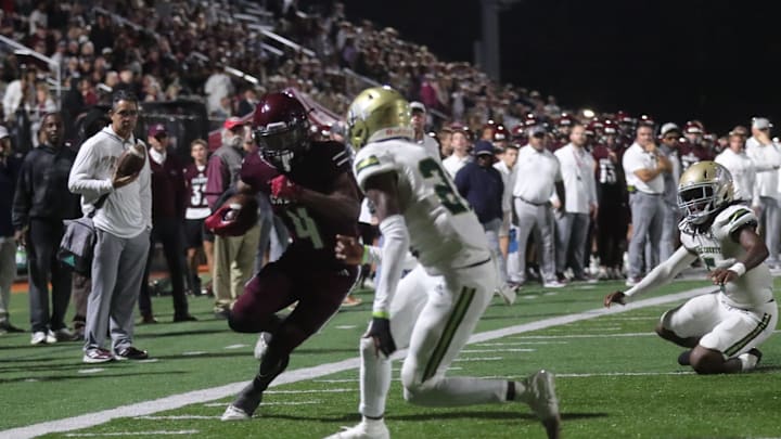 Benedictine's Bubba Frazier lowers his shoulder as he races to the end zone against Ware County's Cameron King on Friday October 11, 2024 at Memorial Stadium. Benedictine's Bubba Frazier lowers his shoulder as he races to the end zone against Ware County's Cameron King on Friday October 11, 2024 at Memorial Stadium.