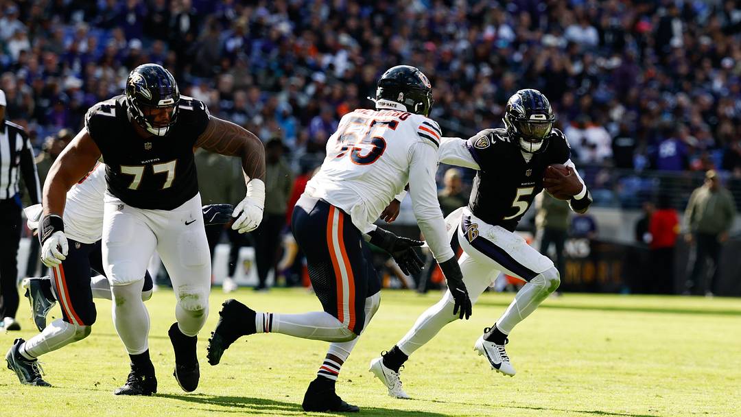 Baltimore Ravens quarterback Tyler Huntley and Chicago Bears defensive end Dayo Odeyingbo. Baltimore Ravens quarterback Tyler Huntley and Chicago Bears defensive end Dayo Odeyingbo.