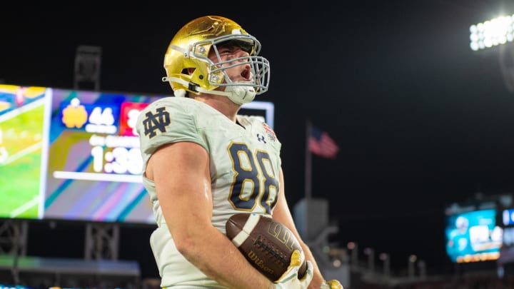 Dec 30, 2022; Jacksonville, FL, USA; Notre Dame Fighting Irish tight end Mitchell Evans (88) celebrates his touchdown against the South Carolina Gamecocks in the fourth quarter in the 2022 Gator Bowl at TIAA Bank Field. Mandatory Credit: Jeremy Reper-USA TODAY Sports