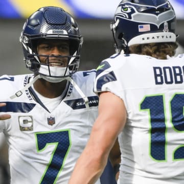 Nov 19, 2023; Inglewood, California, USA; Seattle Seahawks quarterback Geno Smith (7) and wide receiver Jake Bobo (19)  during pregame warmup before an NFL game against the Los Angeles Rams at SoFi Stadium.