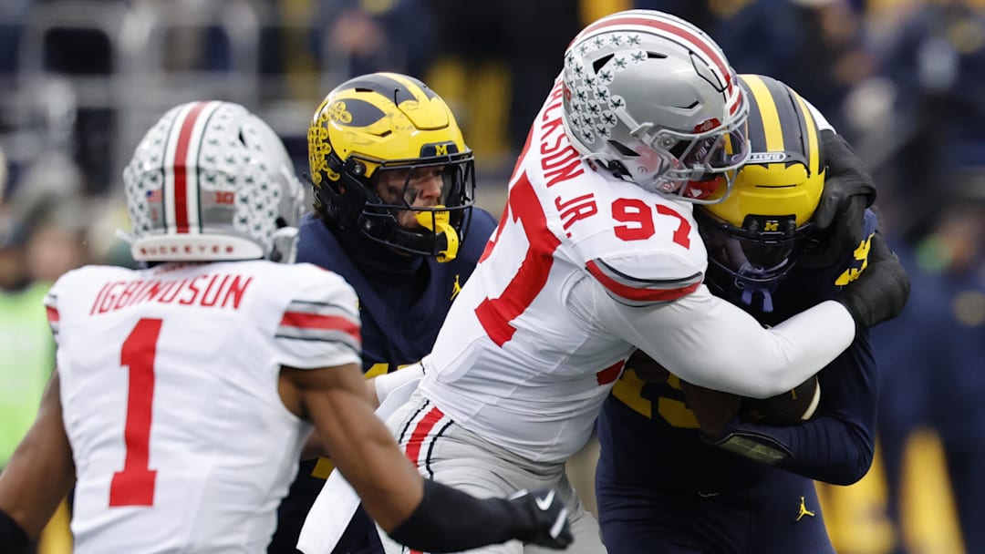 Ohio State Buckeyes defensive end Kenyatta Jackson Jr. (97) tackles Michigan Wolverines quarterback Bryce Underwood (19) Ohio State Buckeyes defensive end Kenyatta Jackson Jr. (97) tackles Michigan Wolverines quarterback Bryce Underwood (19)