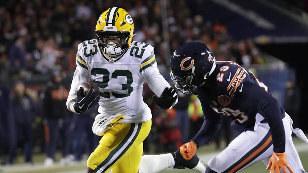 Dec 20, 2025; Chicago, Illinois, USA; Green Bay Packers running back Emanuel Wilson (23) runs for a gain against Chicago Bears cornerback Tyrique Stevenson (29) in the second quarter at Soldier Field. Mandatory Credit: Dan Powers-USA TODAY Network via Imagn Images Dec 20, 2025; Chicago, Illinois, USA; Green Bay Packers running back Emanuel Wilson (23) runs for a gain against Chicago Bears cornerback Tyrique Stevenson (29) in the second quarter at Soldier Field. Mandatory Credit: Dan Powers-USA TODAY Network via Imagn Images
