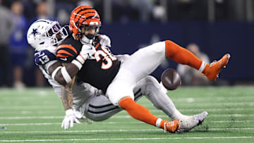 Dec 9, 2024; Arlington, Texas, USA; Dallas Cowboys linebacker DeMarvion Overshown (13) breaks up a pass intended for Cincinnati Bengals running back Chase Brown (30) on fourth down in the second quarter at AT&T Stadium. Mandatory Credit: Tim Heitman-Imagn Images