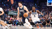 May 28, 2024; Dallas, Texas, USA; Dallas Mavericks guard Luka Doncic (77) dribbles as Minnesota Timberwolves guard Anthony Edwards (5) defends during the third quarter of game four of the western conference finals for the 2024 NBA playoffs at American Airlines Center. Mandatory Credit: Kevin Jairaj-USA TODAY Sports