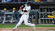 Chicago White Sox designated hitter Andrew Benintendi (23) hits a solo home run against the Milwaukee Brewers at Rate Field. 