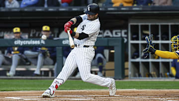 Chicago White Sox designated hitter Andrew Benintendi (23) hits a solo home run against the Milwaukee Brewers at Rate Field. 