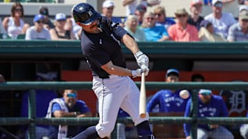 Mar 3, 2025; Lakeland, Florida, USA; Detroit Tigers catcher Jake Rogers (34) hits a single during the third inning against the Toronto Blue Jays at Publix Field at Joker Marchant Stadium.