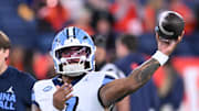 Oct 31, 2025; Syracuse, New York, USA; North Carolina Tar Heels quarterback Gio Lopez (7) warms up before a game against the Syracuse Orange at the JMA Wireless Dome. Mandatory Credit: Mark Konezny-Imagn Images